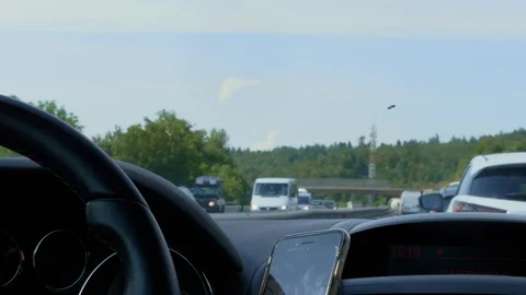Slow car driving in traffic jam on highway, steering wheel Video stock 114564178