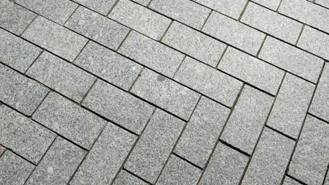 Slow circular movement on the stones of a paved street Stockbeeldmateriaal 196827991