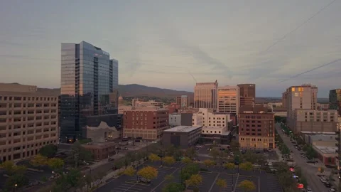 Slow climbing ascending drone shot of vibrant downtown Boise at sunset Stock Footage 339503875