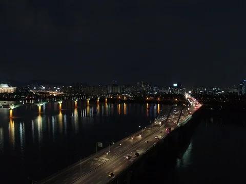 Slow climbing shot over Han River with bridges and night traffic in Seoul Stock Footage 78105532