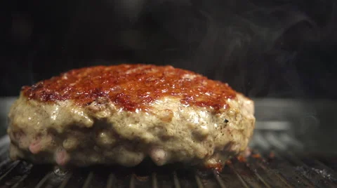 SLOW-CLOSE UP: A fried beefsteak on a grill Stock Footage 63069143