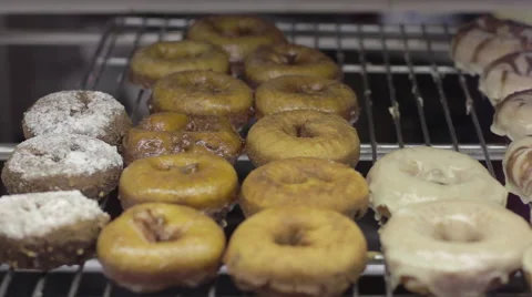 Slow, close up tracking shot of donuts in a bakery Stock-Footage 60721225