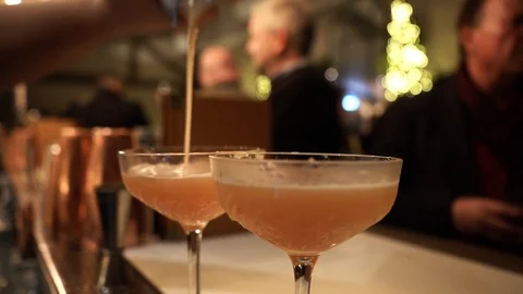 Slow close up of two drinks being prepared at the bar Stock Footage 106810654