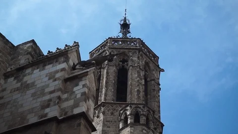 A slow cloud passes over the Barcelona Cathedral's Bell tower Stock Footage 96314831