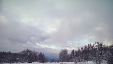 Slow clouds floating over a snowy mountain Stock Footage 83079952