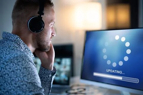 Slow Computer System Update At Night Stock Photos