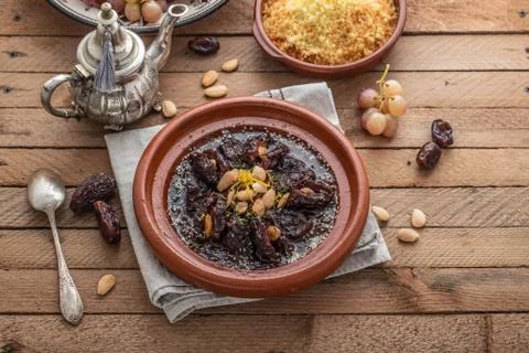 Slow cooked beef with dates, raisins and almonds - moroccan tajine Stock Photos