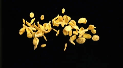 SLOW: Corn Flakes fly up and fall Stock Footage 49065343