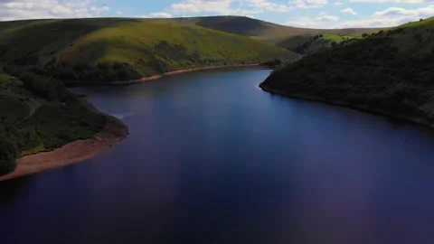Slow decent and flying backward over Meldon resevoir, Devon, UK 動画素材 135519734