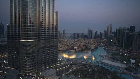 Slow descent down Burj Khalifa from 150m to 100m, pull back to reveal Burj Stock Footage 98960014