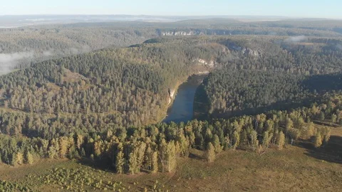 Slow direct flight over a gentle mountain river, pine forest, clouds. Ay river. Stock Footage 101631154