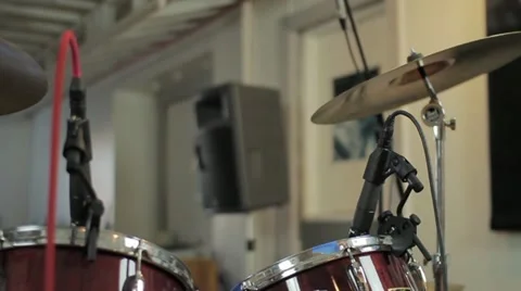 Slow dolly across Drum Set with microphones - Medium Shot Stock Footage 11147206