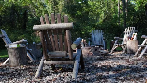 Slow dolly move dry fire pit with wooden chairs.mov Stock Footage 95762829