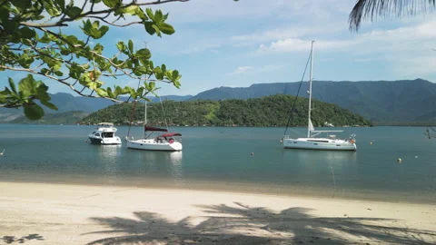 Slow Dolly Move Out, Onto A Private Beach, Seeing Boats And An Island Ahead, 4k Stock Footage 239688379