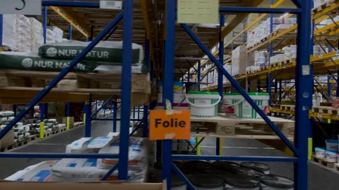Slow dolly side shot of large warehouse with wide sill at wholesale Video stock 145837649