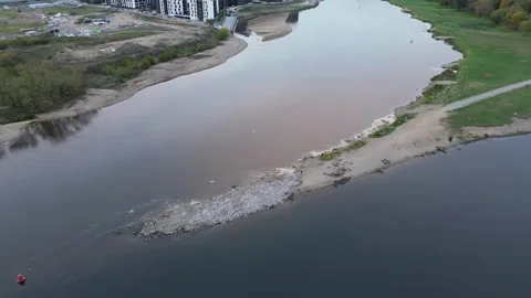 Slow down facing reveal of river junction in Kaunas with calming bird pack Stock Footage 254085287