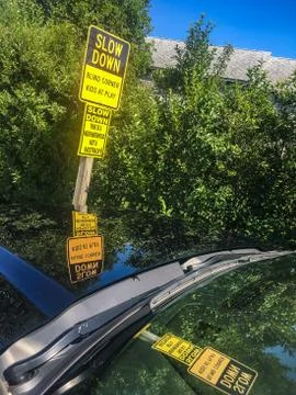 Slow Down Sign Reflecting In Windscreen Stock Photos