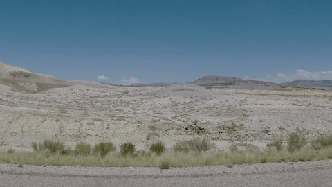 Slow drive on I70 through Utah desert, midsummer, clear blue skies, Stock Footage 95162953