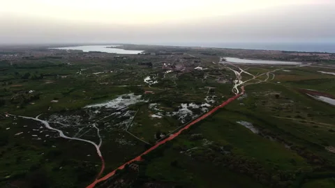 Slow drone advancing over plain with river background, Senegal Видео 331991180