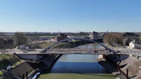 Slow drone approach to bridge traffic by canal Stock Footage 331896981