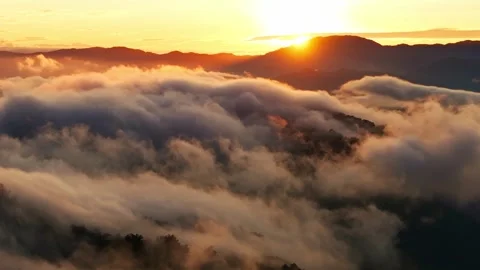 Slow drone backward flight sunrise clouds over Baguio East Benguet Philippines 스톡 동영상 331117152