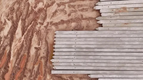 Slow Drone Descent Over Concrete Foundation Piles Vídeos de archivo 337623368