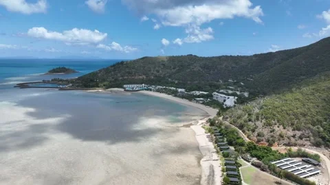 Slow drone drift in daytime with a subtle pan right, holding a wide view of Stock Footage 331025110