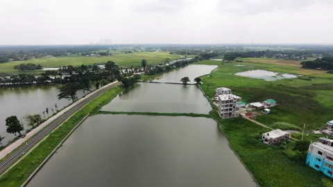 Slow Drone Flight Over Countryside Fish Ponds and Rural Railway Track Stock Footage 335878633