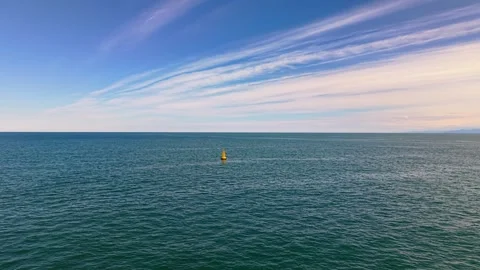 Slow Drone Flight Over Sea Toward Yellow Buoy in 4K Stock-Footage 337777986
