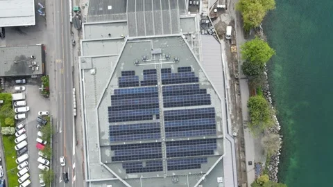 Slow drone flying over solar panels rooftop renewable energy Stockbeeldmateriaal 332707287