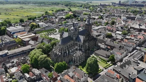 Slow Drone Orbit Left of Gothic European Cathedral in Old City, Sunny 2 Stock Footage 308821013