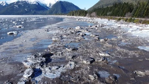 Slow drone over Icy river shore 4K Stock Footage 149147247