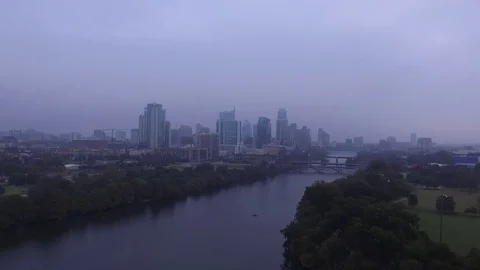 Slow Drone Pull Away from Lady Bird Lake and Downtown Austin on Foggy Morning Stock Footage 70535304