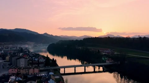 Slow drone push in over river at sunset Stock Footage 330545555