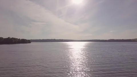 Slow Drone Rising Over River Tamar with Sky and Trees in Frame 4k Stock Footage 320946583