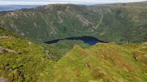 Slow drone shot on Ulriken mountain edge in Bergen Norway, July 2026 Stock Footage 340080225