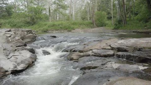 Slow Drone Track Backwards Over Waterfall Stock Footage 273344229