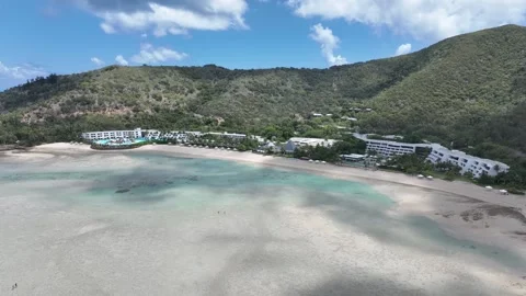 Slow drone tracking shot in daytime, moving sideways along Hayman Island’s Stock Footage 331025646