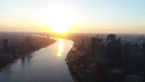 Slow Drone View of Huangpu River along the Bund in Shanghai at Sunset Stock Footage 243259867