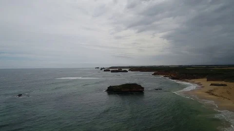 Slow drone view of rolling water and coastline Stock Footage 84314488