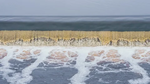 Slow Drop of Water from the Dam 4K Stock Footage 149784484