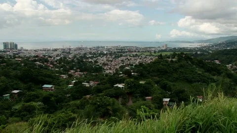 Slow elevated pan across Port of Spain Stock Footage 75749188