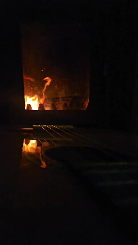 Slow fire in the fireplace and guitar Stock Footage 297222953