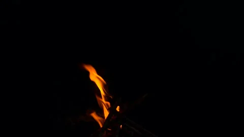 Slow fire flame burning and glowing on dark night screen background Stock Footage 247206069