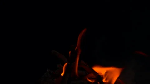Slow fire flame burning and glowing on dark night screen background Stock Footage 247207450