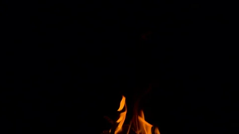 Slow fire flame burning and glowing on dark night screen background Stock Footage 247208118