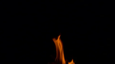 Slow fire flame burning and glowing on dark night screen background Stock Footage 247225399