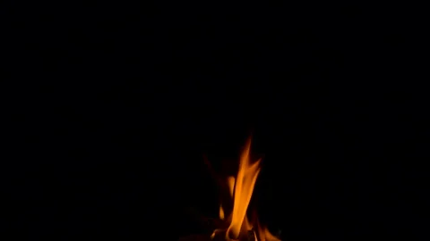 Slow fire flame burning and glowing on dark night screen background Stock Footage 247225593