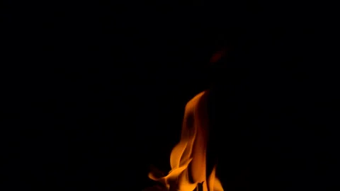 Slow fire flame burning and glowing on dark night screen background Stock Footage 247225625