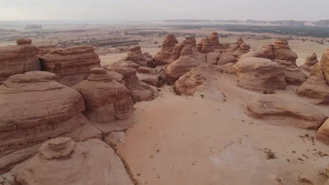 Slow flight across rock formation, Saudi Arabia, Al Ula. 4K Aerial at sunset. Stock Footage 196834485